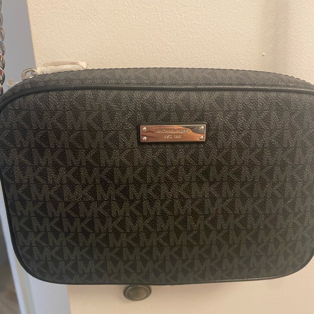Never used authentic Black Michael Kohrs crossbody. Perfect condition.